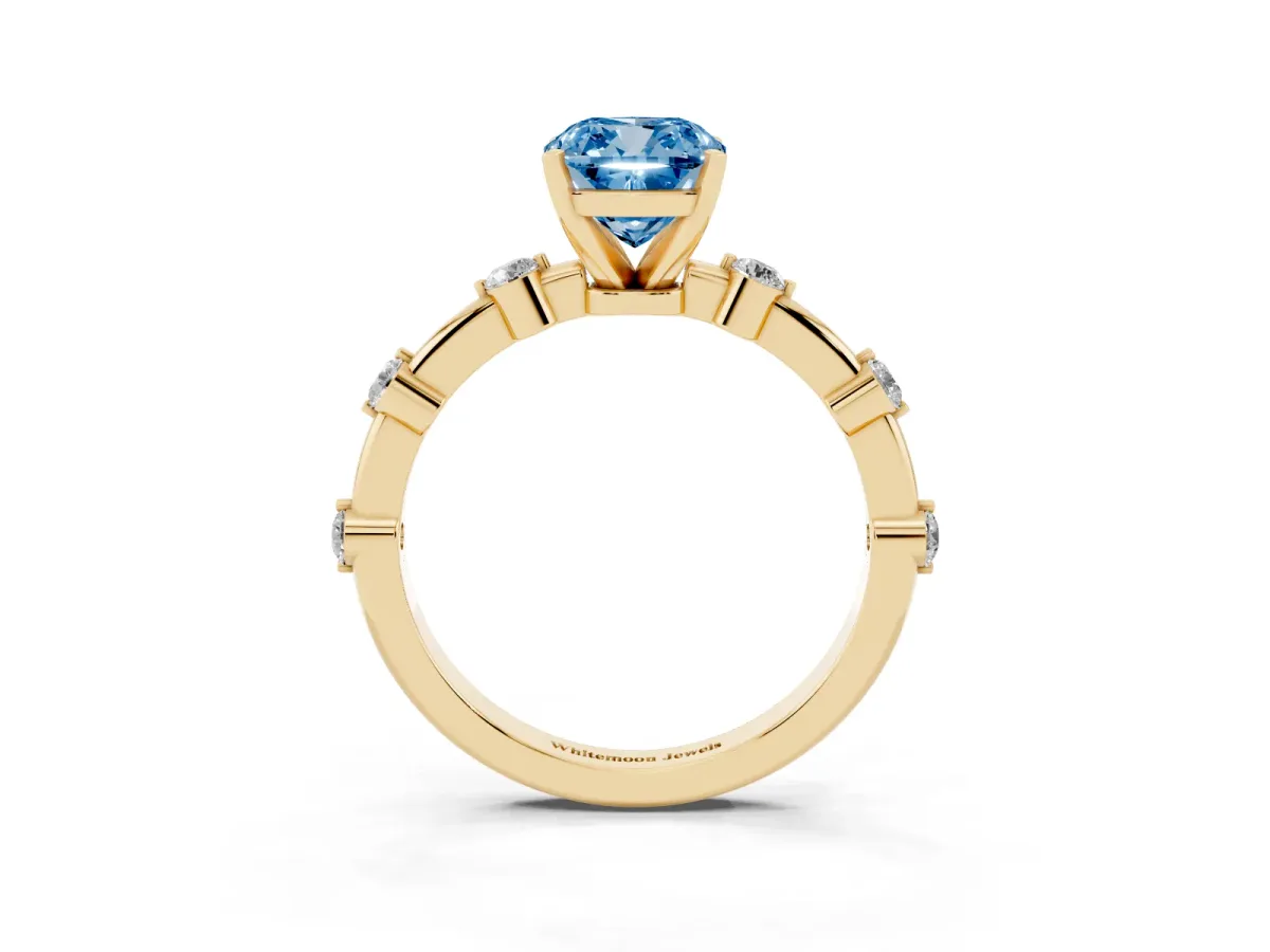 Fancy Blue Cushion Cut Solitaire Diamond Ring with Bezel Set Side Stones and Prong Setting Yellow gold