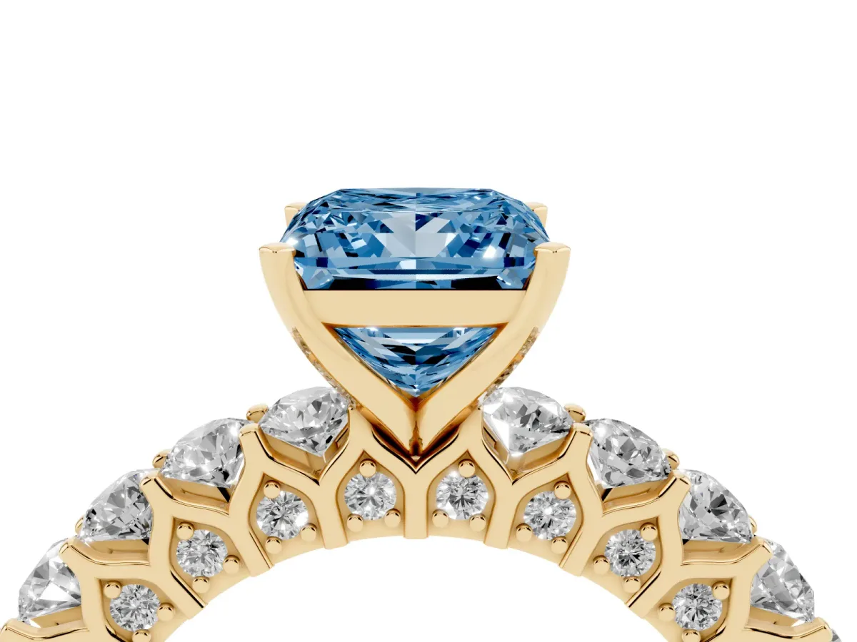 Fancy Blue Princess Cut Diamond Solitaire Ring with Shared Prong Pavé Band and Four-Prong Setting Yellow gold