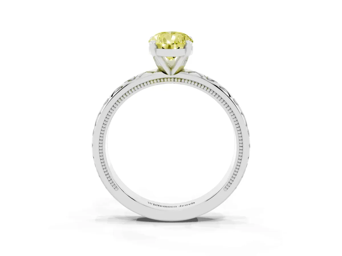 Fancy Yellow Pear Cut Solitaire Diamond Engagement Ring with XO Engraved Band and Four-Prong Setting Silver