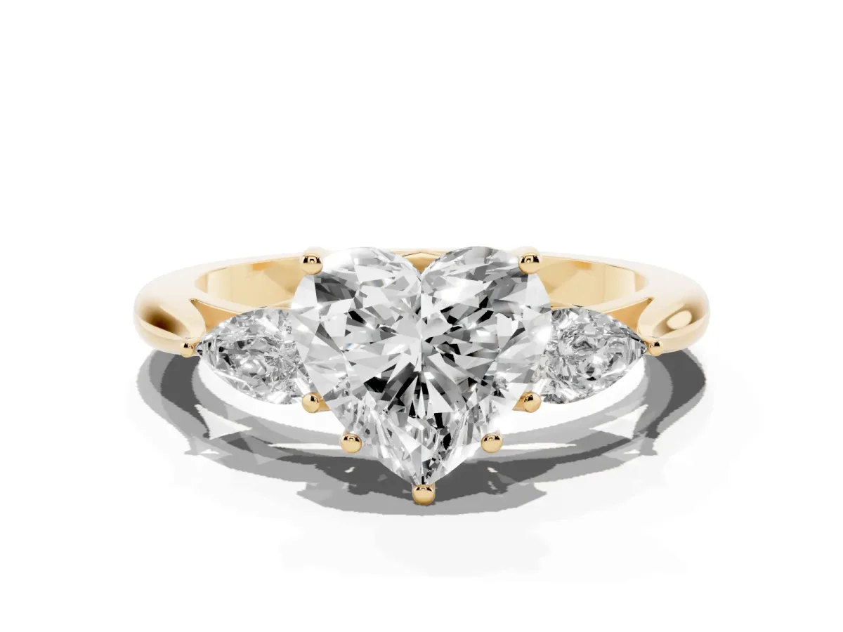 Heart Cut Diamond Three-Stone Ring with Pear Side Stones and Prong Setting Yellow gold