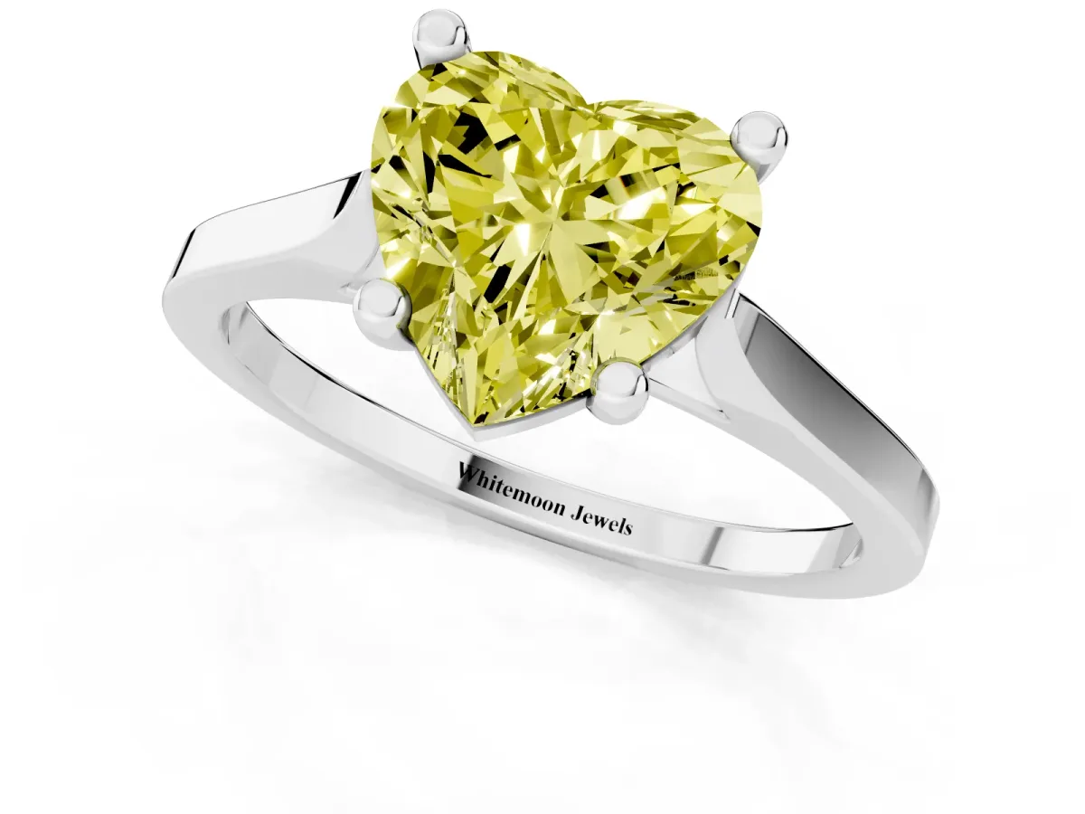 Fancy Yellow Heart Cut Solitaire Diamond Ring with Four-Prong Setting and Tapered Band Silver