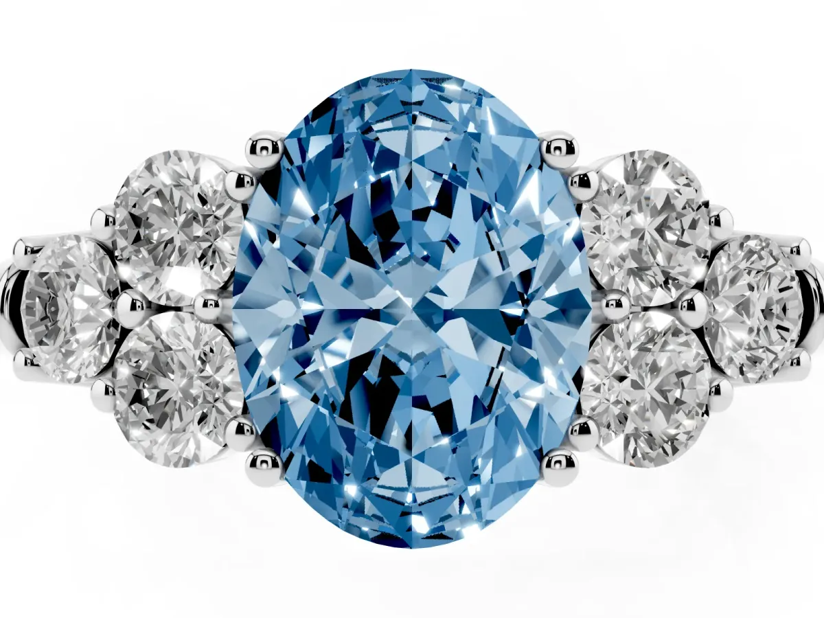 Fancy Blue Oval Cut Cut Diamond Cluster Ring with Round Accent Stones and Prong Setting on a Classic Band Silver