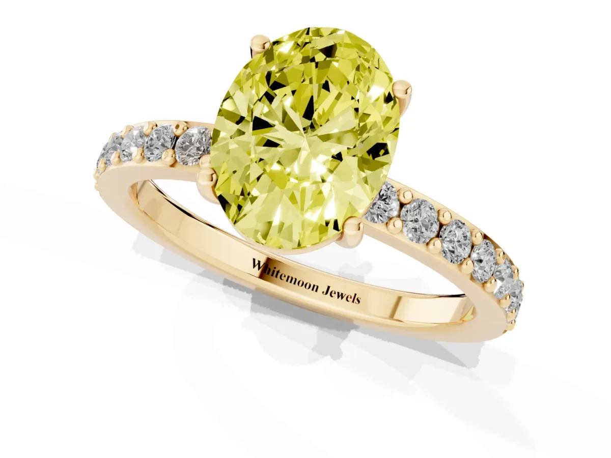 Fancy Yellow Oval Cut Cut Diamond Solitaire with Pave Band and Four-Prong Setting Yellow gold