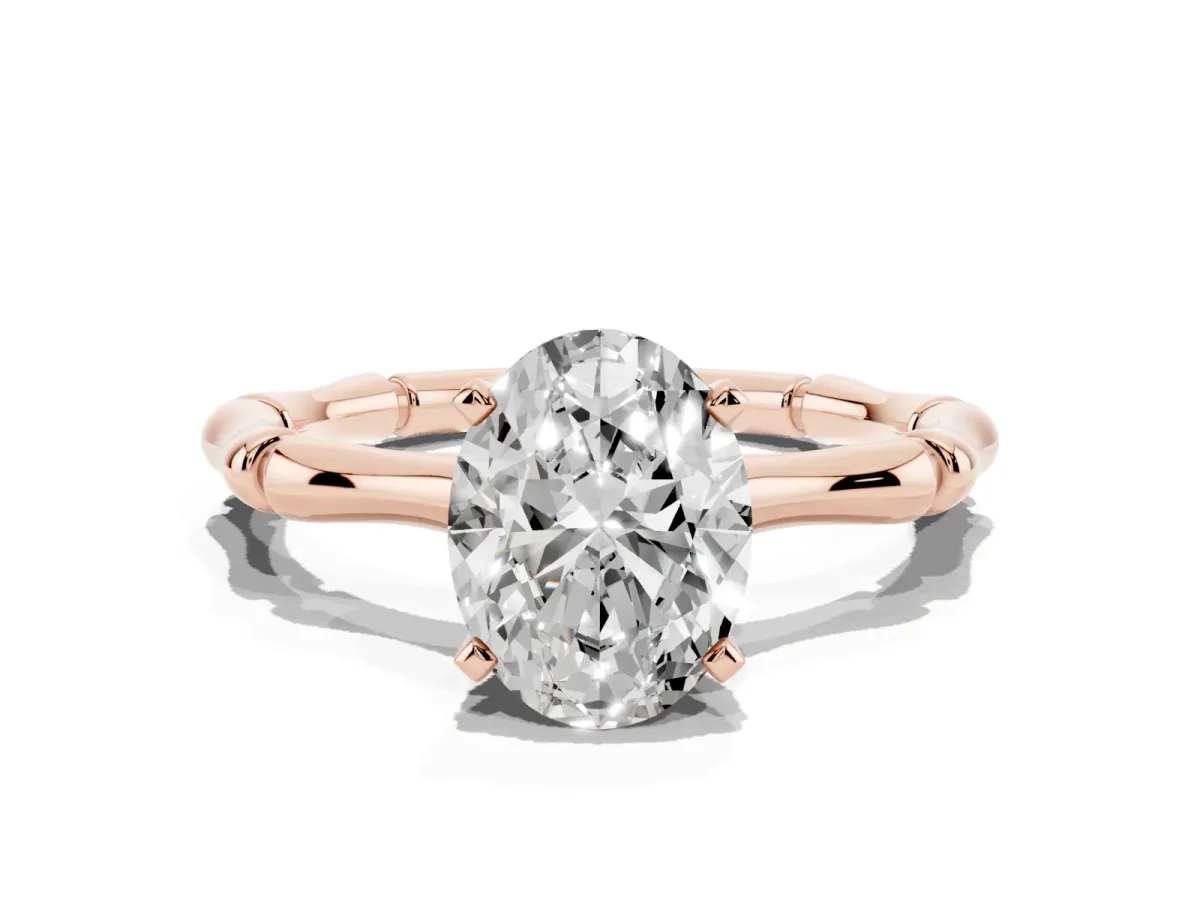 Oval Cut Solitaire Diamond Ring with Bamboo Band and Four-Prong Setting Rose gold