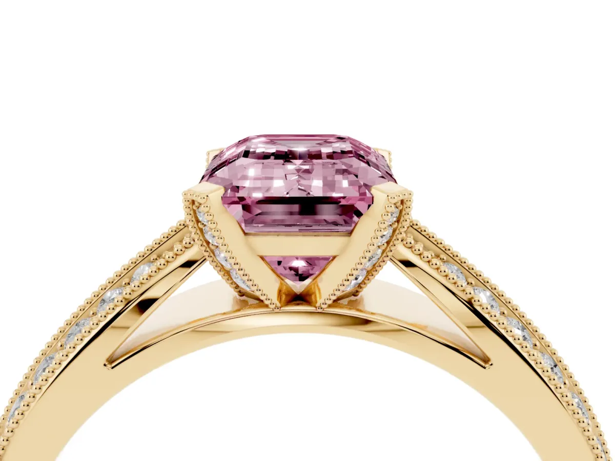 Fancy Pink Emerald Cut Diamond Solitaire Ring with Milgrain Round Pavé Band and Prong Setting Yellow gold