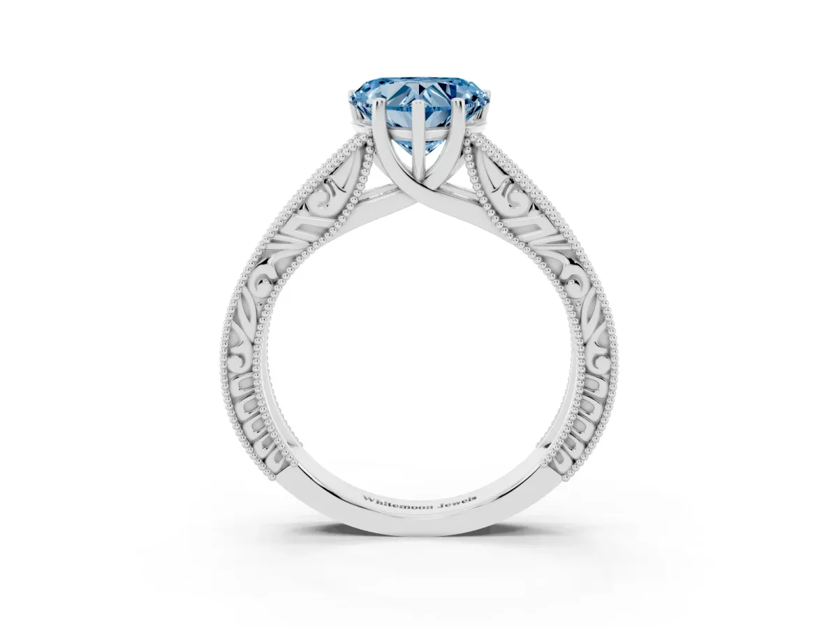 Fancy Blue Heart Cut Diamond Solitaire Ring with Engraved Band and Four-Prong Setting Silver