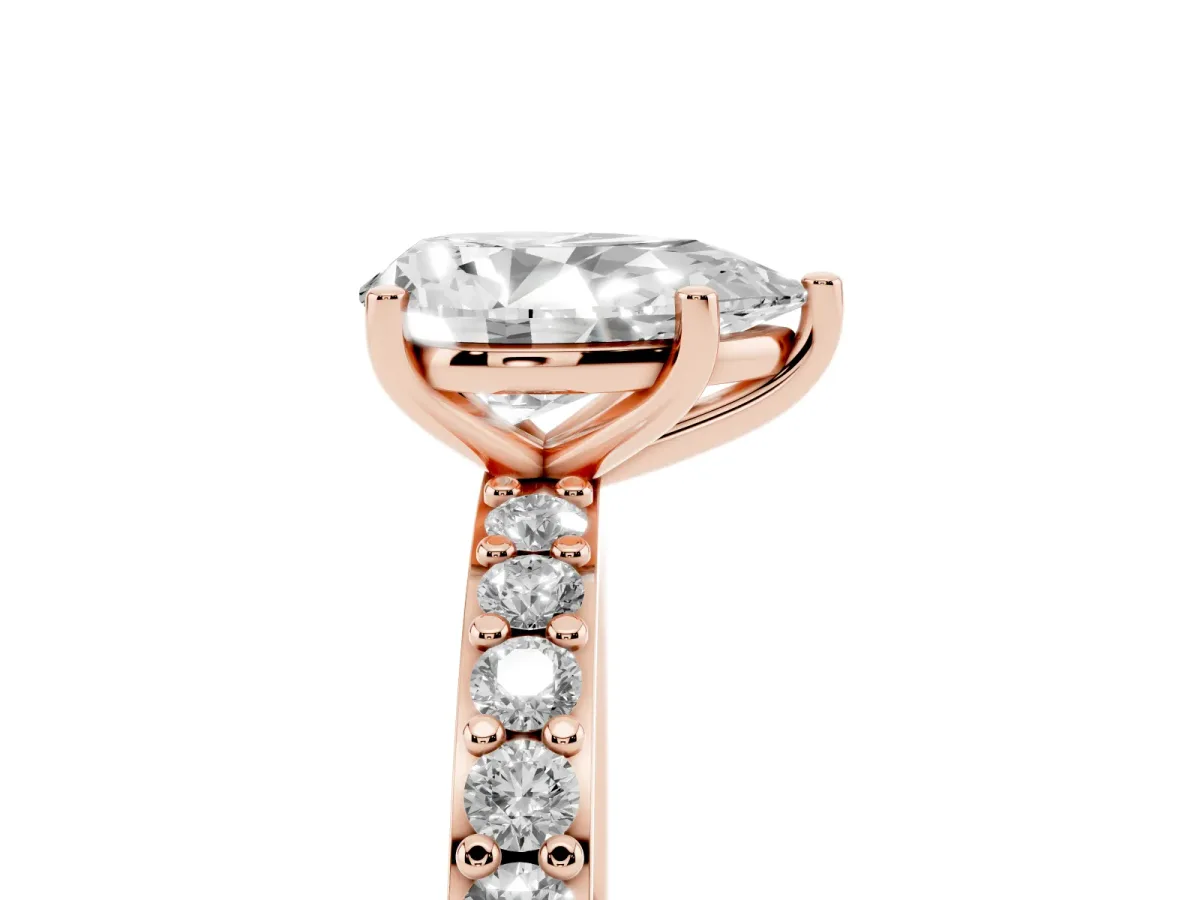 Pear Cut Cut Diamond Solitaire with Pave Band and Four-Prong Setting Rose gold