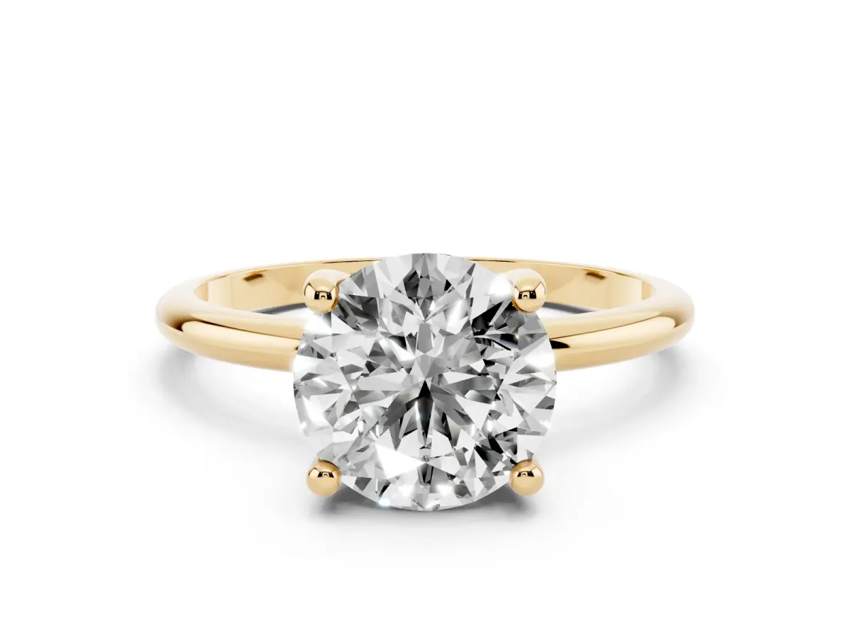Round Cut Solitaire Diamond Ring with 4-Prong Setting on a Classic Band Yellow gold