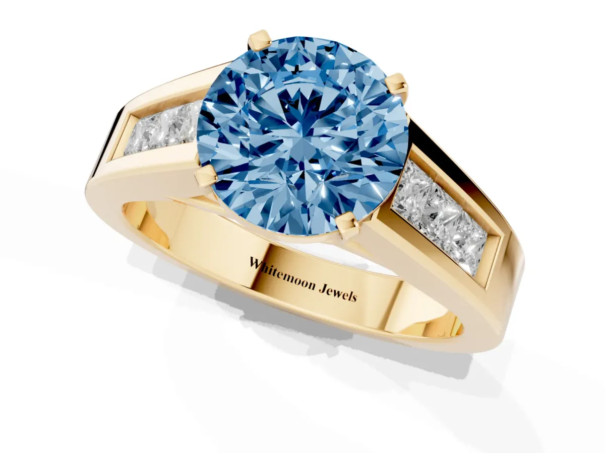 Fancy Blue Round Cut Cut Channel Set Solitaire Ring with Four-Prong Setting Yellow gold