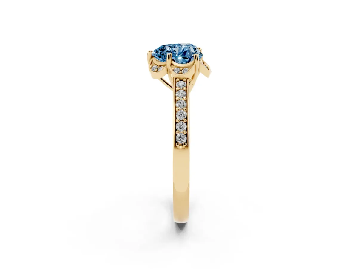 Fancy Blue Heart Cut Cut Halo Diamond Ring with Channel Set Band and Four-Prong Setting Yellow gold