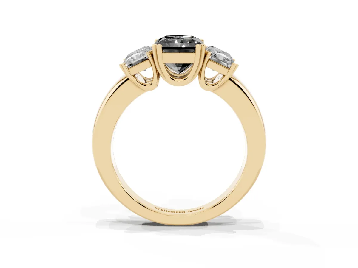Fancy Black Three-Stone Radiant Cut Cut Diamond Ring with Channel Set Band and Four-Prong Setting Yellow gold