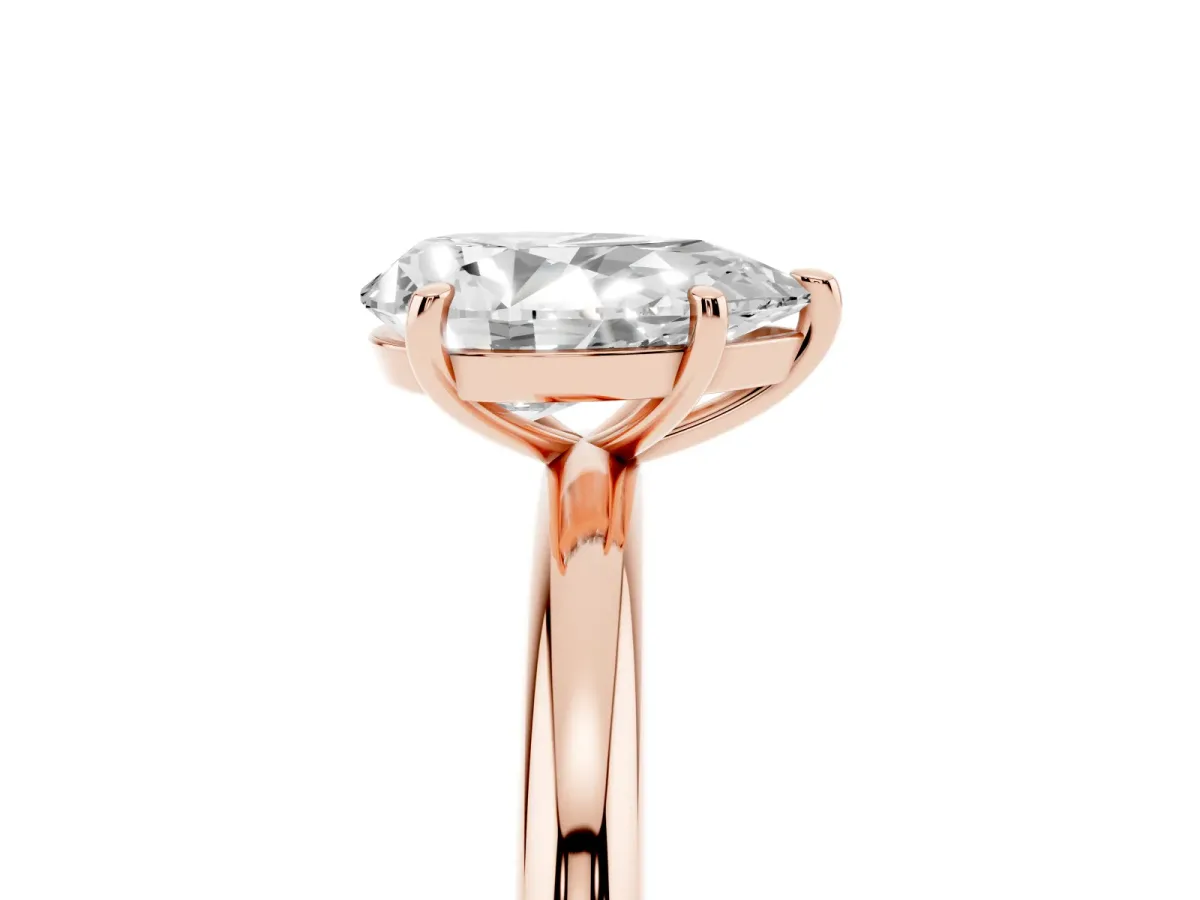 Pear Cut Solitaire Diamond Ring with Four-Prong Setting on a Plain Band Rose gold