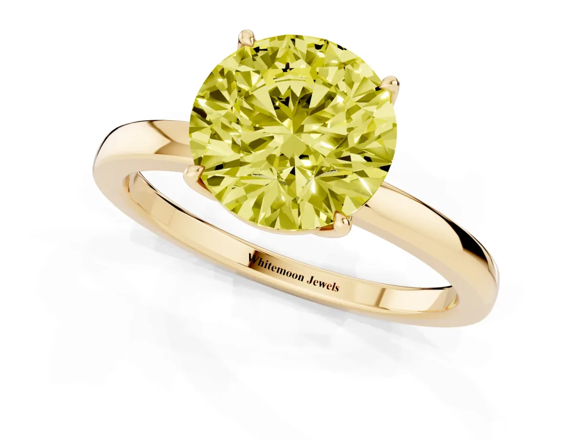 Fancy Yellow Round Cut Diamond Solitaire Ring with Thin Band and Prong Setting Yellow gold