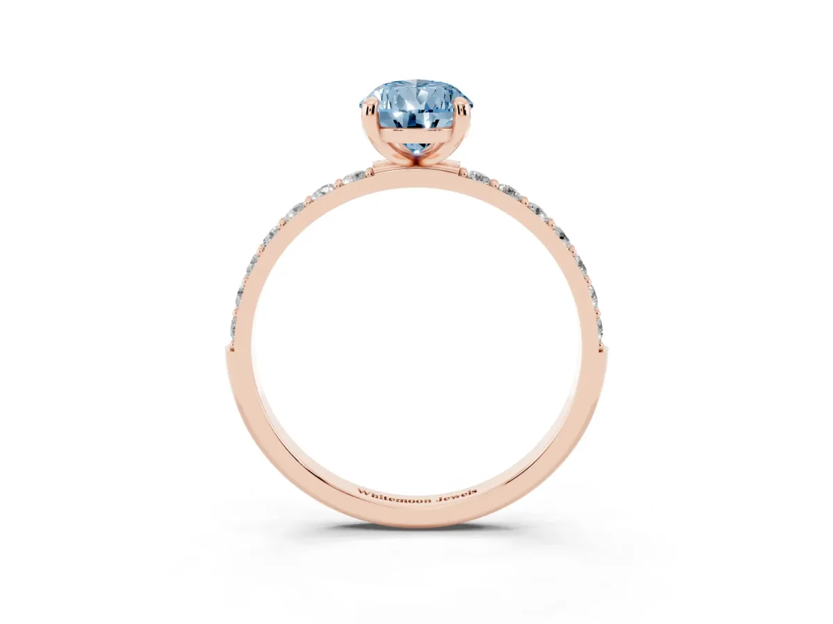 Fancy Blue Pear Cut Diamond Solitaire Ring with Round Pavé Band and Prong Setting Rose gold