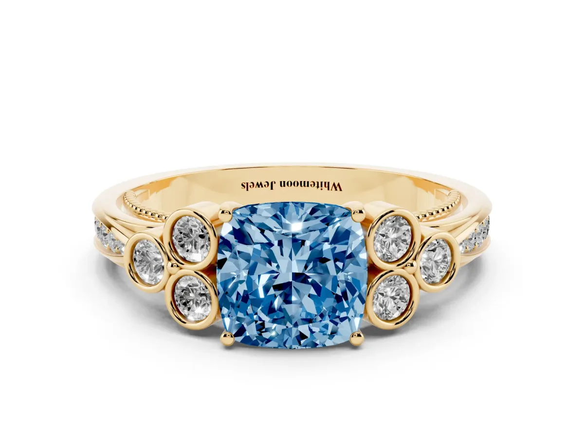 Fancy Blue Cushion Cut Cut Diamond Engagement Ring with Bezel Set Round Side Stones and Prong Setting Yellow gold