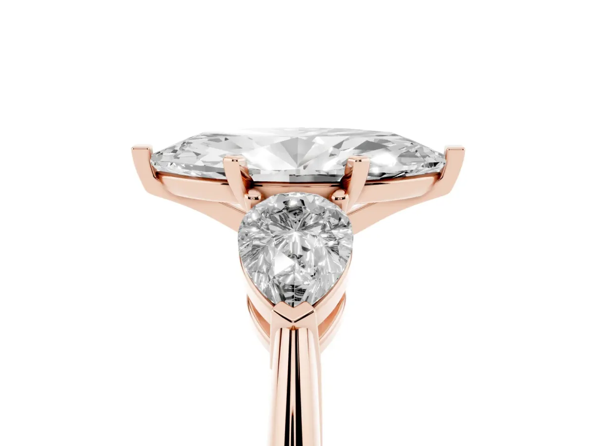 Three-Stone Marquise Cut Diamond Ring with Pear Side Stones and Four-Prong Setting Rose gold