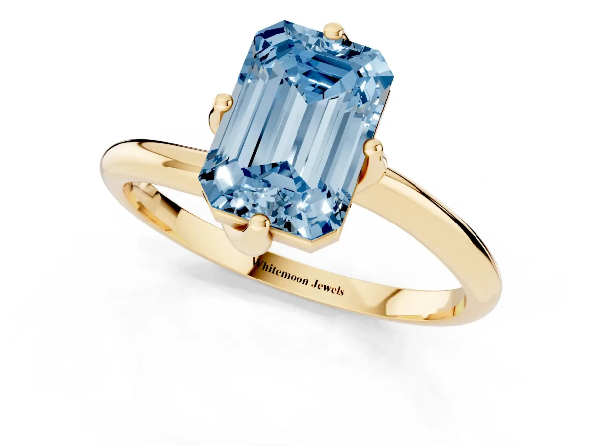 Fancy Blue Emerald Cut Diamond Solitaire Engagement Ring with Four-Prong Setting and Classic Band Yellow gold