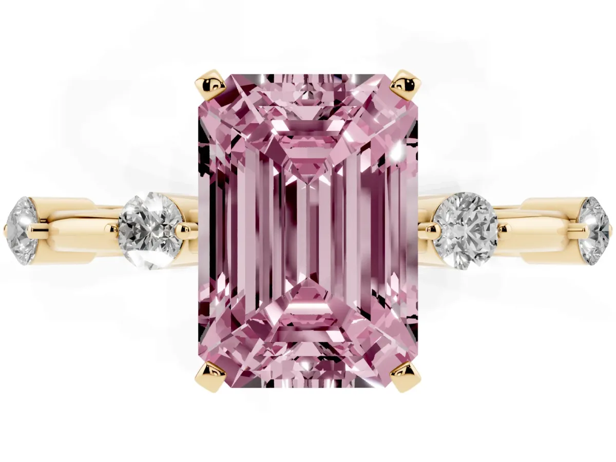 Fancy Pink Emerald Cut Solitaire Diamond Ring with Bezel Set Side Stones and Prong Setting Yellow gold