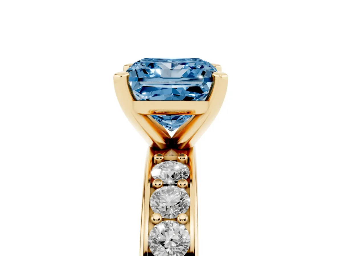 Fancy Blue Princess Cut Diamond Engagement Ring with Channel Set Round Band and Prong Setting Yellow gold