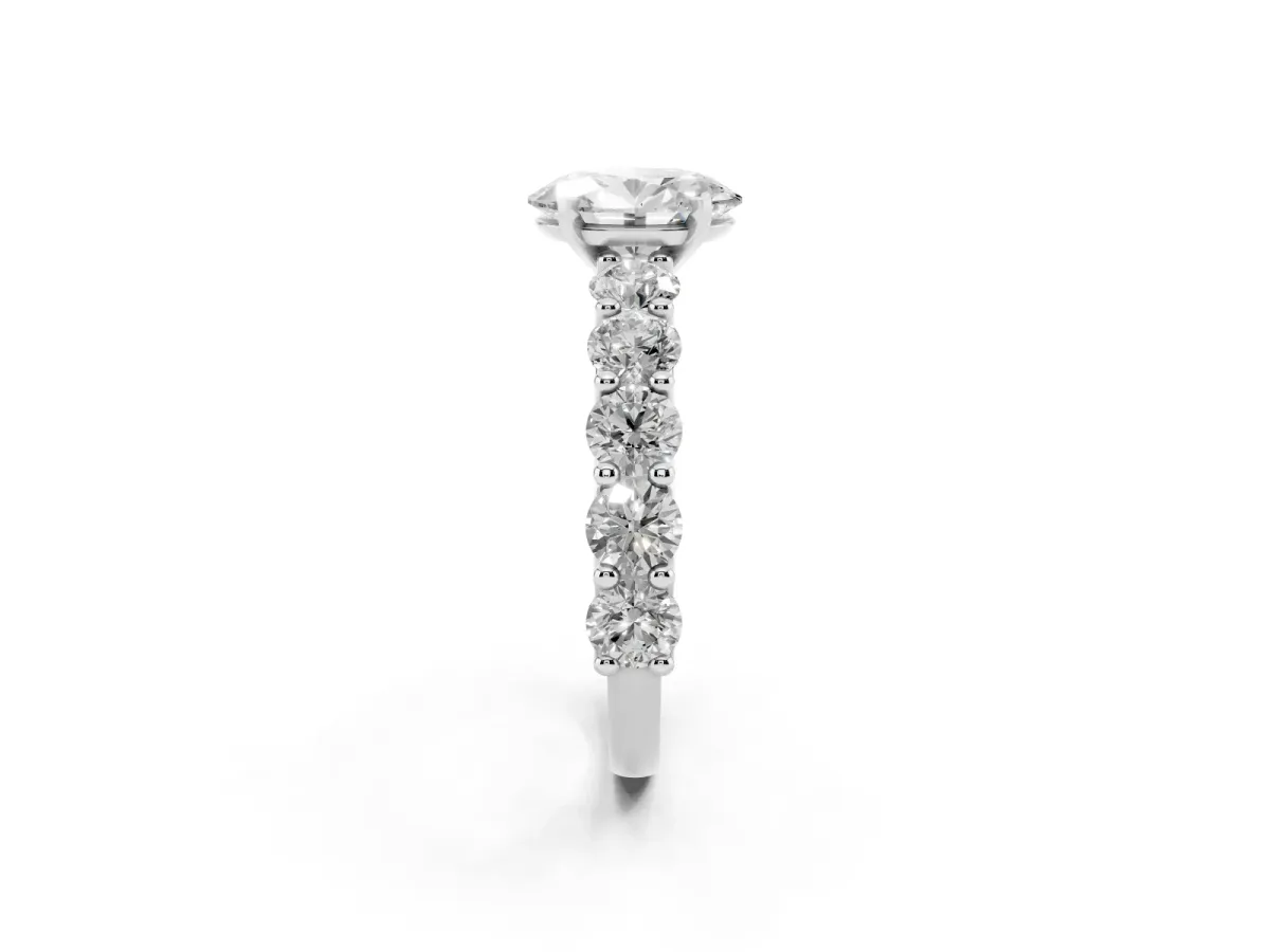 Oval Cut Diamond Prong Setting with Side Stones on a Pave Band Silver