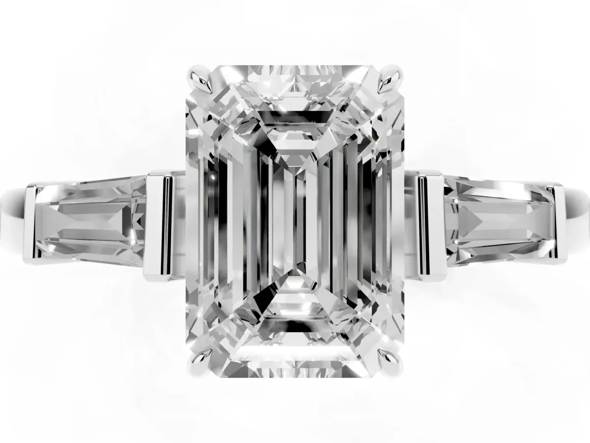 Emerald Cut Diamond Three-Stone Ring with Tapered Baguette Side Stones and Prong Setting White gold