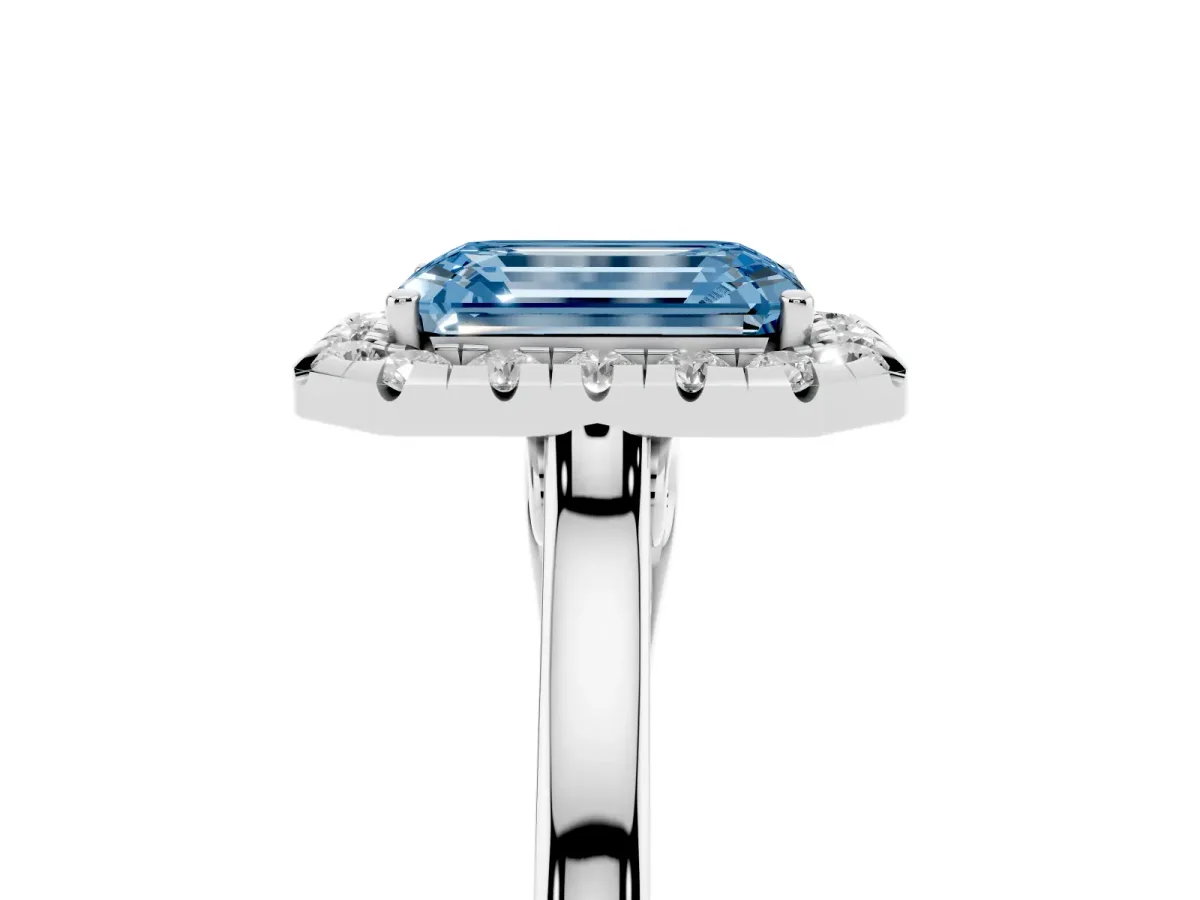 Fancy Blue Emerald Cut Halo Round Diamond Solitaire Ring with Pavé Band and Four-Prong Setting Silver