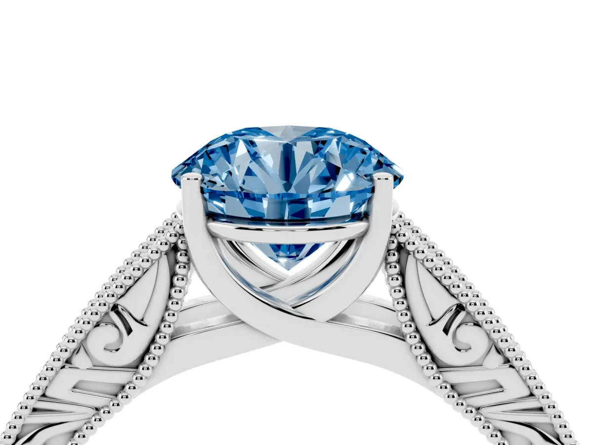Fancy Blue Round Cut Diamond Solitaire Ring with Engraved Band and Four-Prong Setting White gold