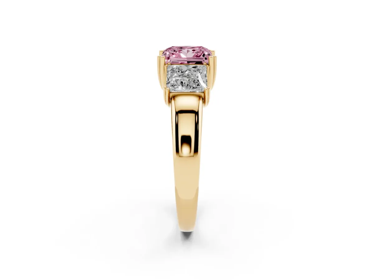 Fancy Pink Three-Stone Princess Cut Cut Diamond Ring with Channel Set Band and Four-Prong Setting Yellow gold