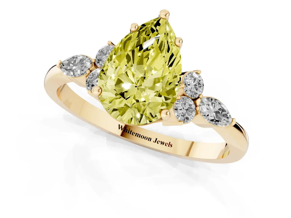 Fancy Yellow Pear Cut Brilliant Diamond Solitaire Ring with Pear Side Stones and Four-Prong Setting Yellow gold
