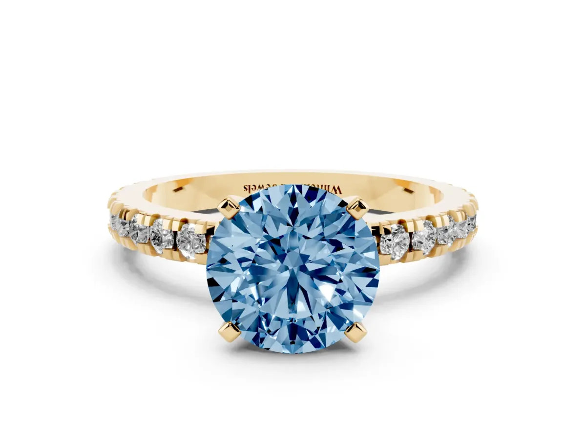 Fancy Blue Round Cut Diamond Pavé Band Solitaire with Four-Prong Setting Yellow gold