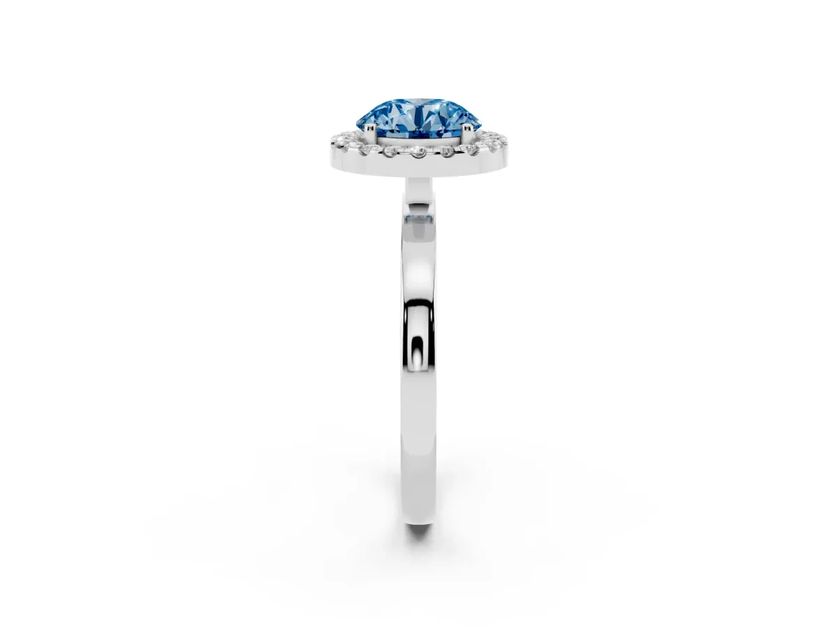 Fancy Blue Round Cut Halo Diamond Solitaire with Pavé Band and Four-Prong Setting Silver