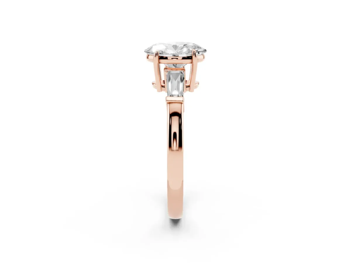 Oval Cut Diamond Three-Stone Ring with Tapered Baguette Side Stones and Prong Setting Rose gold