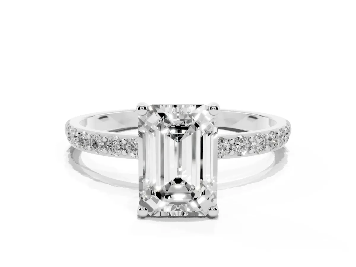 Emerald Cut Diamond Solitaire Ring with Round Pavé Shoulders and Prong Setting Silver