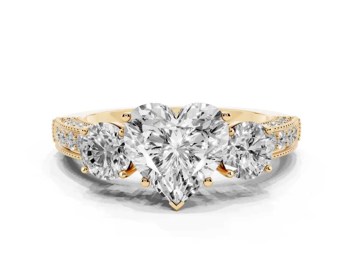 Heart Cut Three-Stone Diamond Ring with Pavé Band and Four-Prong Setting Yellow gold