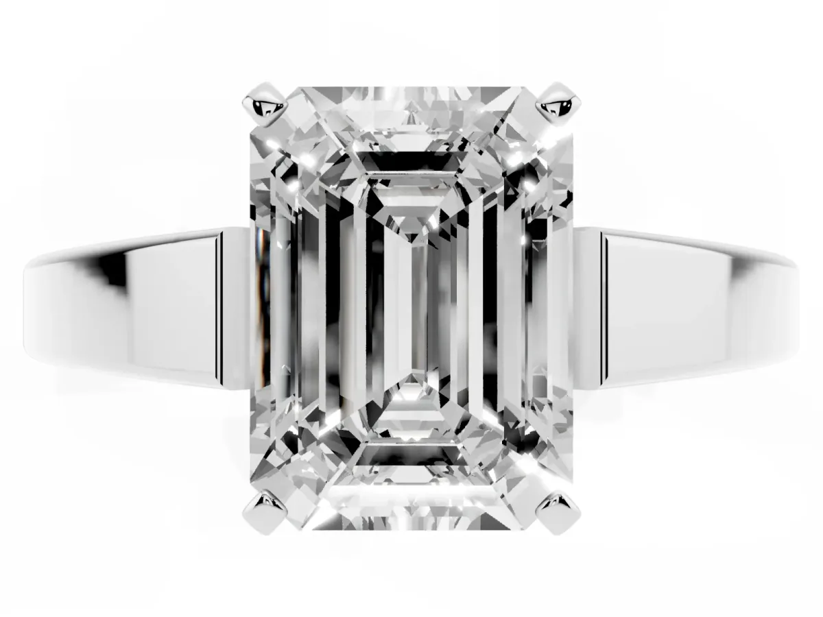 Emerald Cut Solitaire Engagement Ring with Four-Prong Setting and Tapered Band Silver