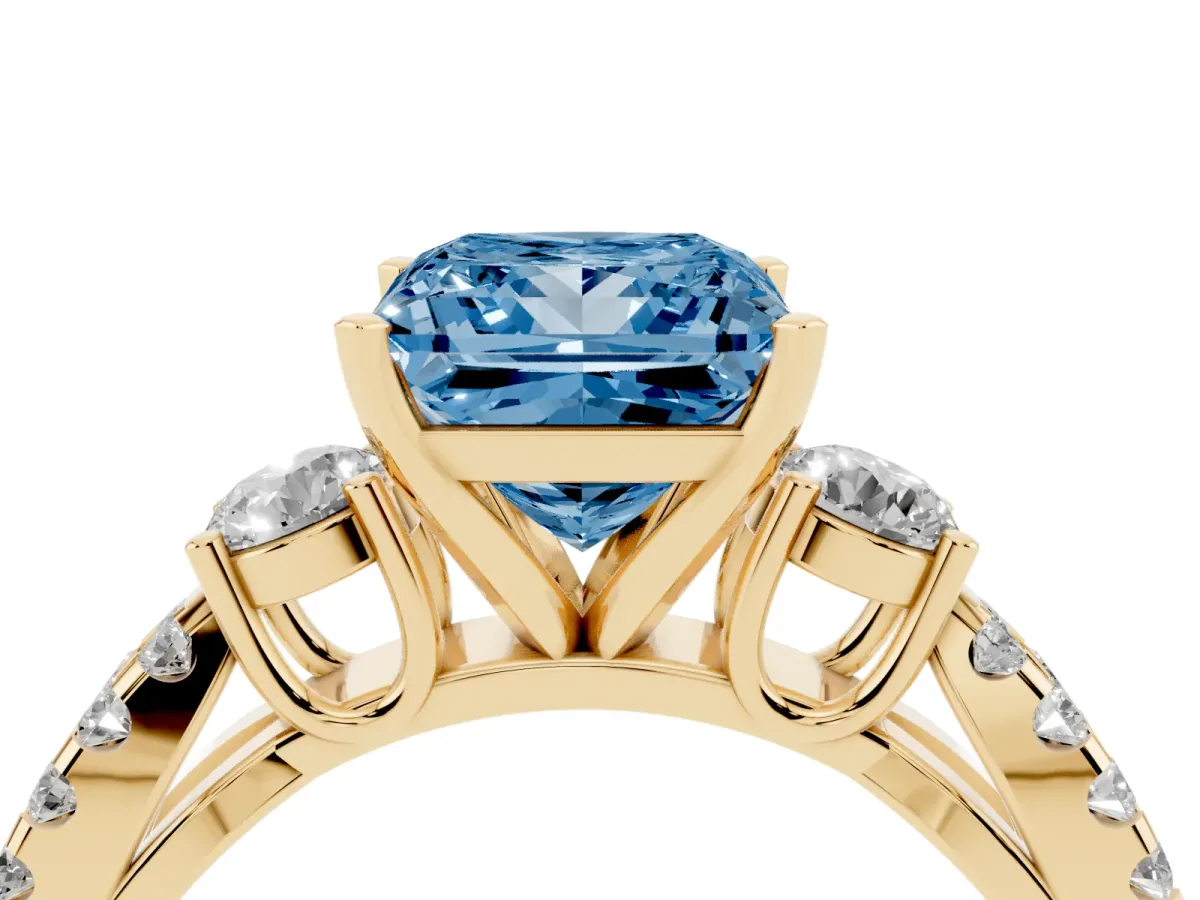Fancy Blue Princess Cut Diamond Three-Stone Ring with Pavé Split Shank and Four-Prong Setting Yellow gold