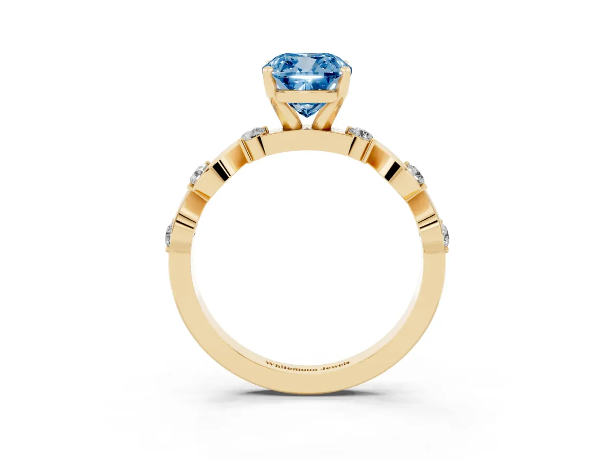 Fancy Blue Cushion Cut Diamond Solitaire Twisted Band with Round Accents and Prong Setting Yellow gold
