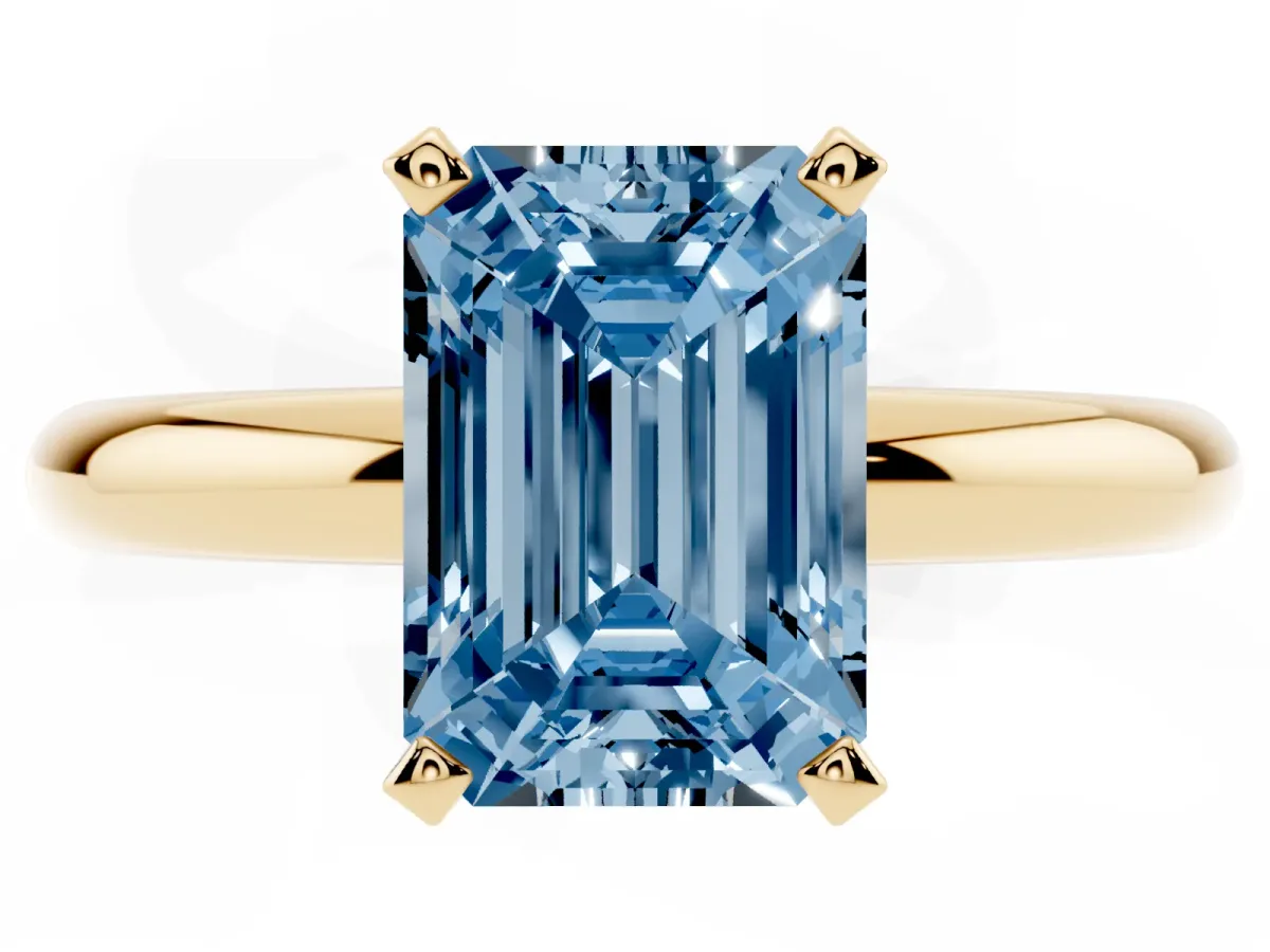 Fancy Blue Emerald Cut Diamond Solitaire Engagement Ring with Round Band and Four-Prong Setting Yellow gold