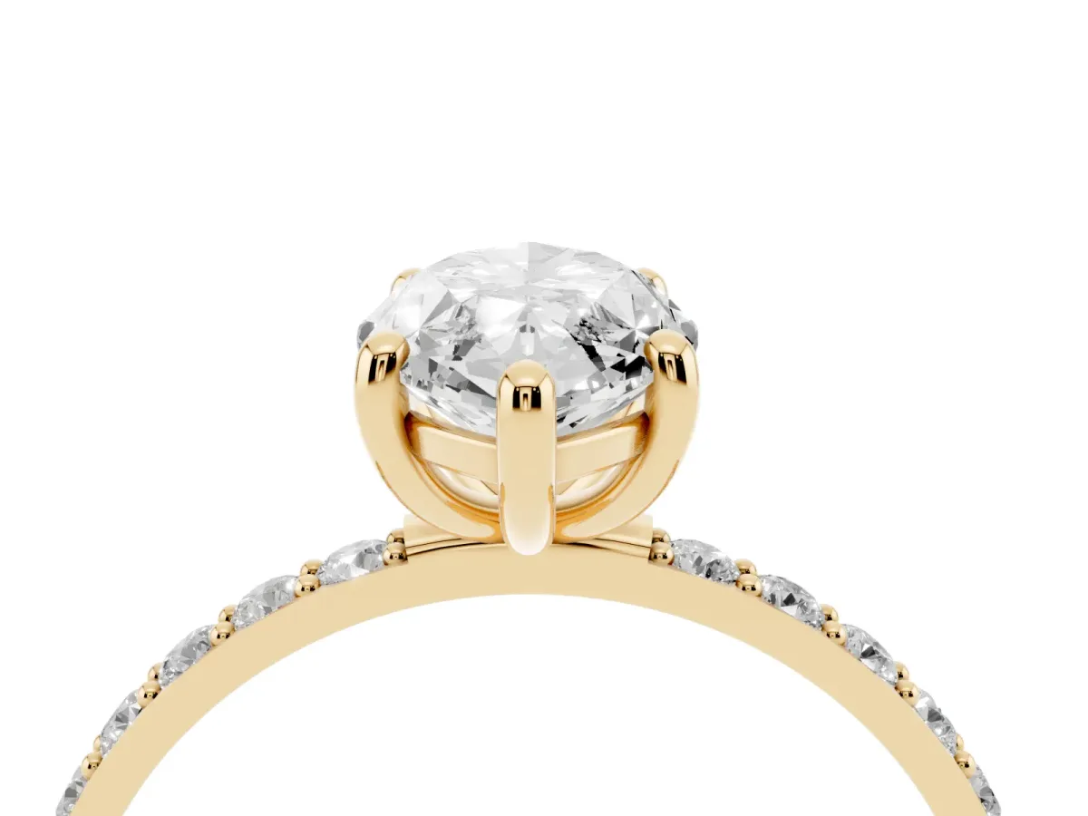 Marquise Cut Diamond Solitaire Ring with Round Pavé Band and Prong Setting Yellow gold
