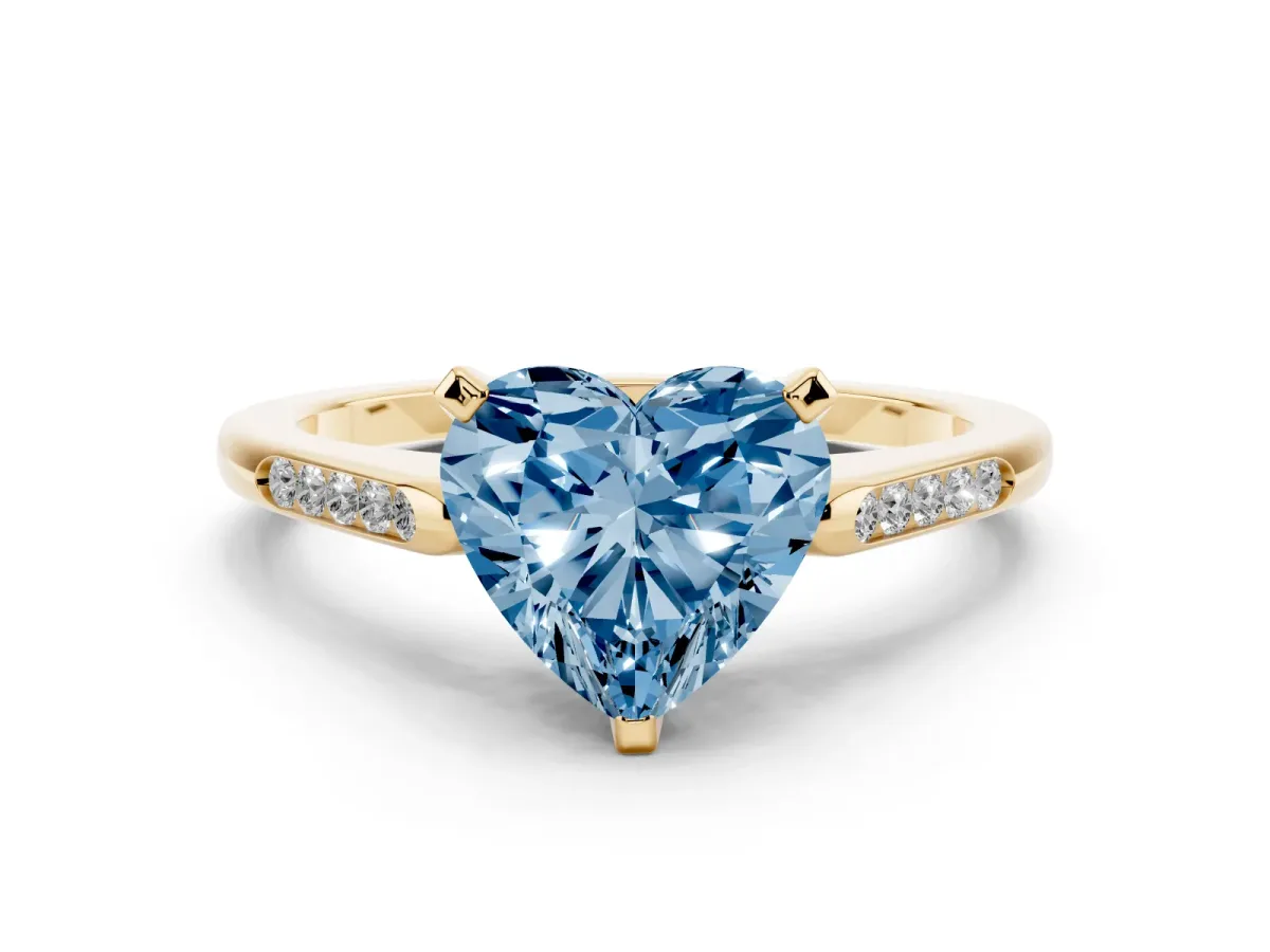 Fancy Blue Heart Cut Diamond Solitaire Ring with Channel Set Round Band and Prong Setting Yellow gold