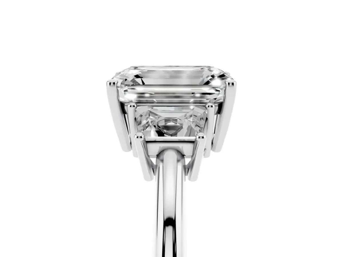 Emerald Cut Diamond Three-Stone Ring with Trapezoid Side Stones and Prong Setting Silver