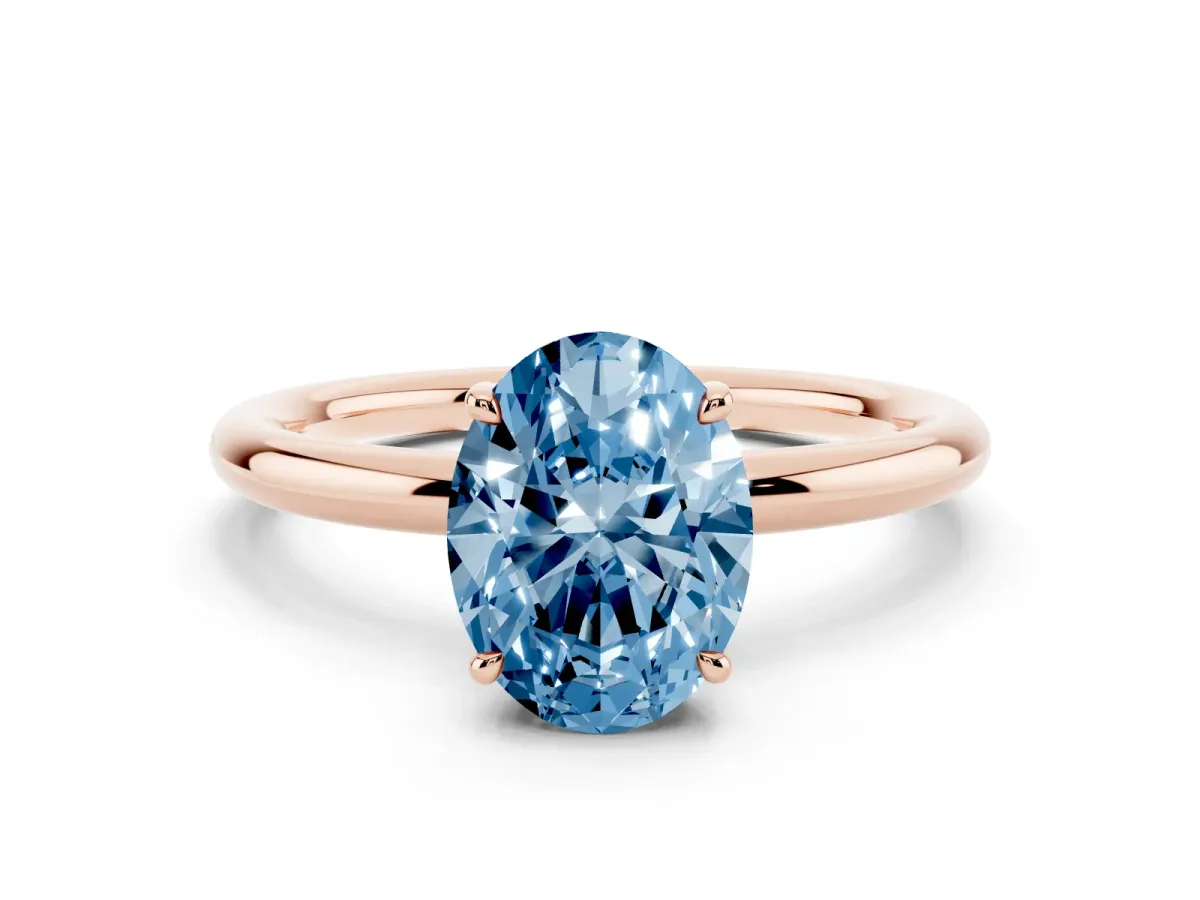 Fancy Blue Oval Cut Diamond Solitaire Ring with Thin Band and Four-Prong Setting Rose gold