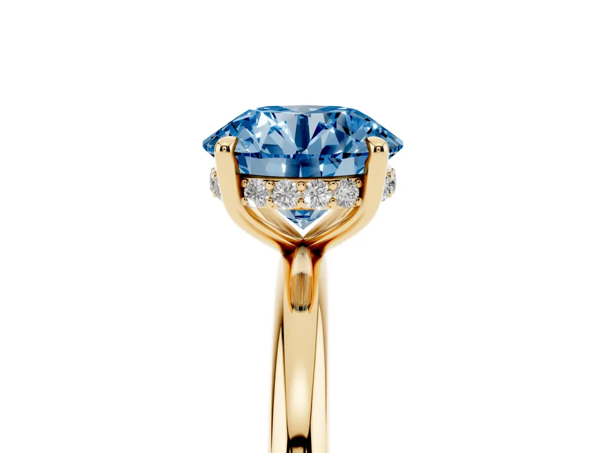 Fancy Blue Round Cut Diamond Solitaire Ring with Thin Band and Four-Prong Setting Yellow gold