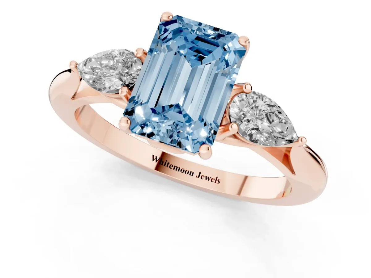 Fancy Blue Emerald Cut Diamond Three-Stone Ring with Pear Side Stones and Prong Setting Rose gold