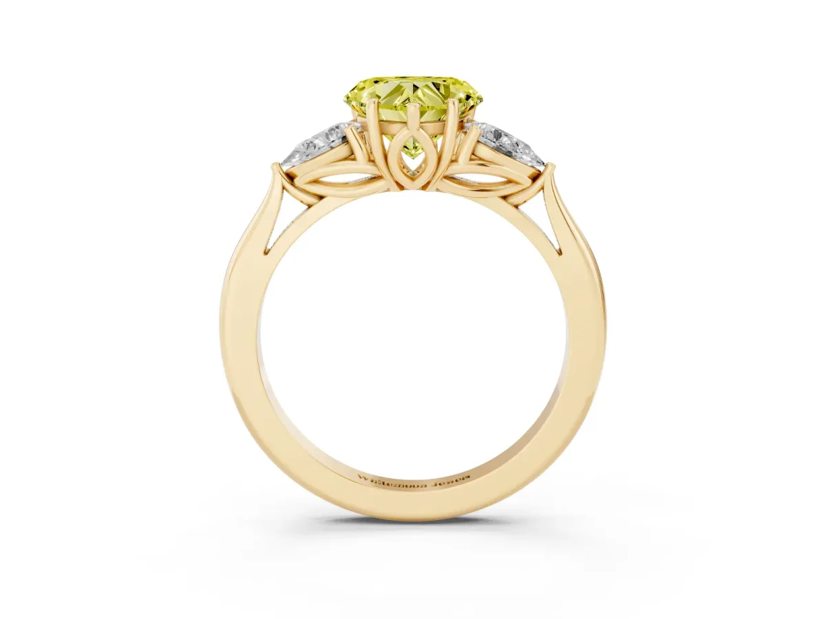 Fancy Yellow Three-Stone Heart Cut Diamond Ring with Pear Side Stones in Four-Prong Setting Yellow gold