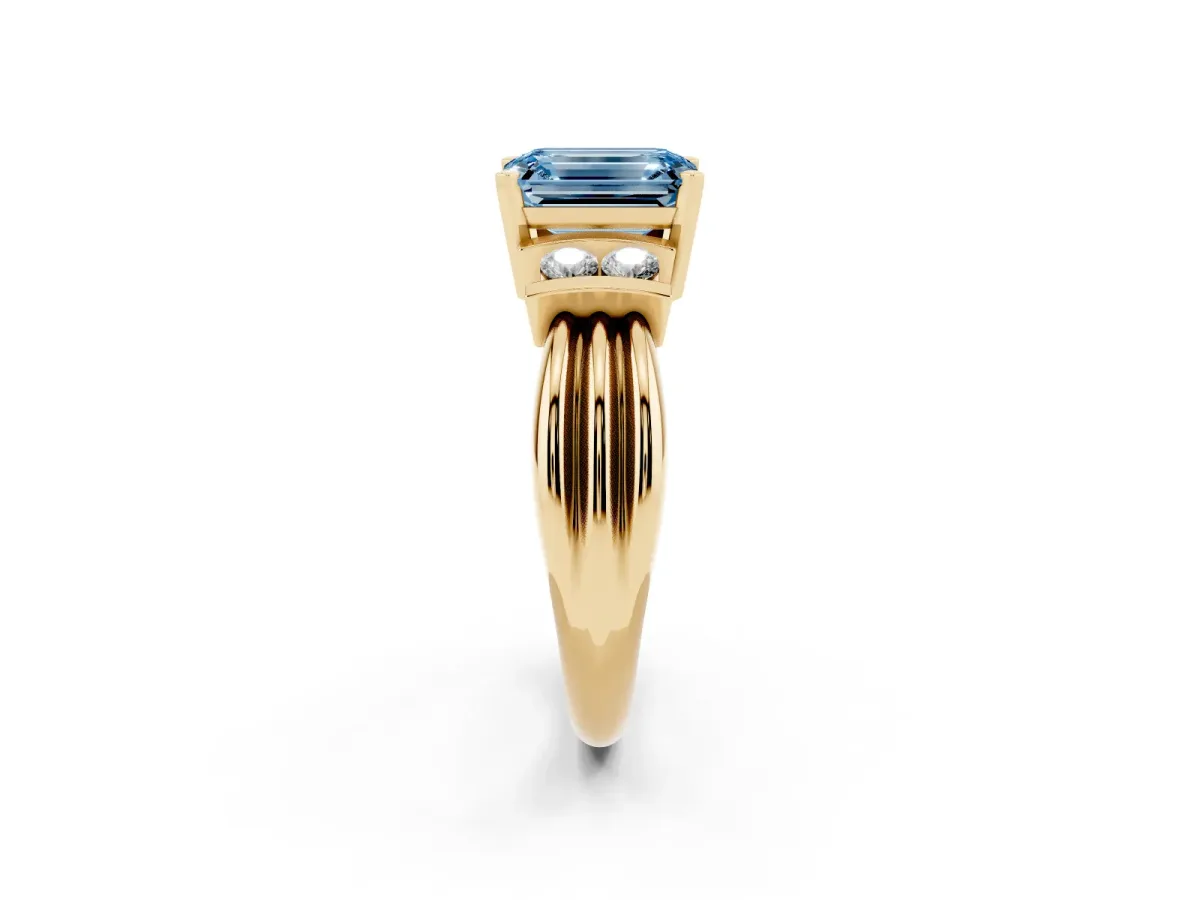 Fancy Blue Emerald Cut Cut Three-Stone Channel Set Ring with Bar Prongs Yellow gold