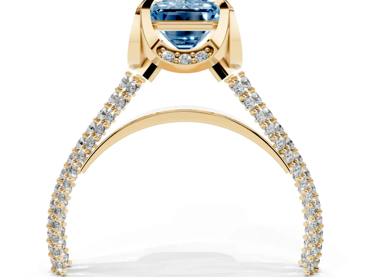 Fancy Blue Emerald Cut Solitaire Pave Split Shank Ring with Four-Prong Setting Yellow gold