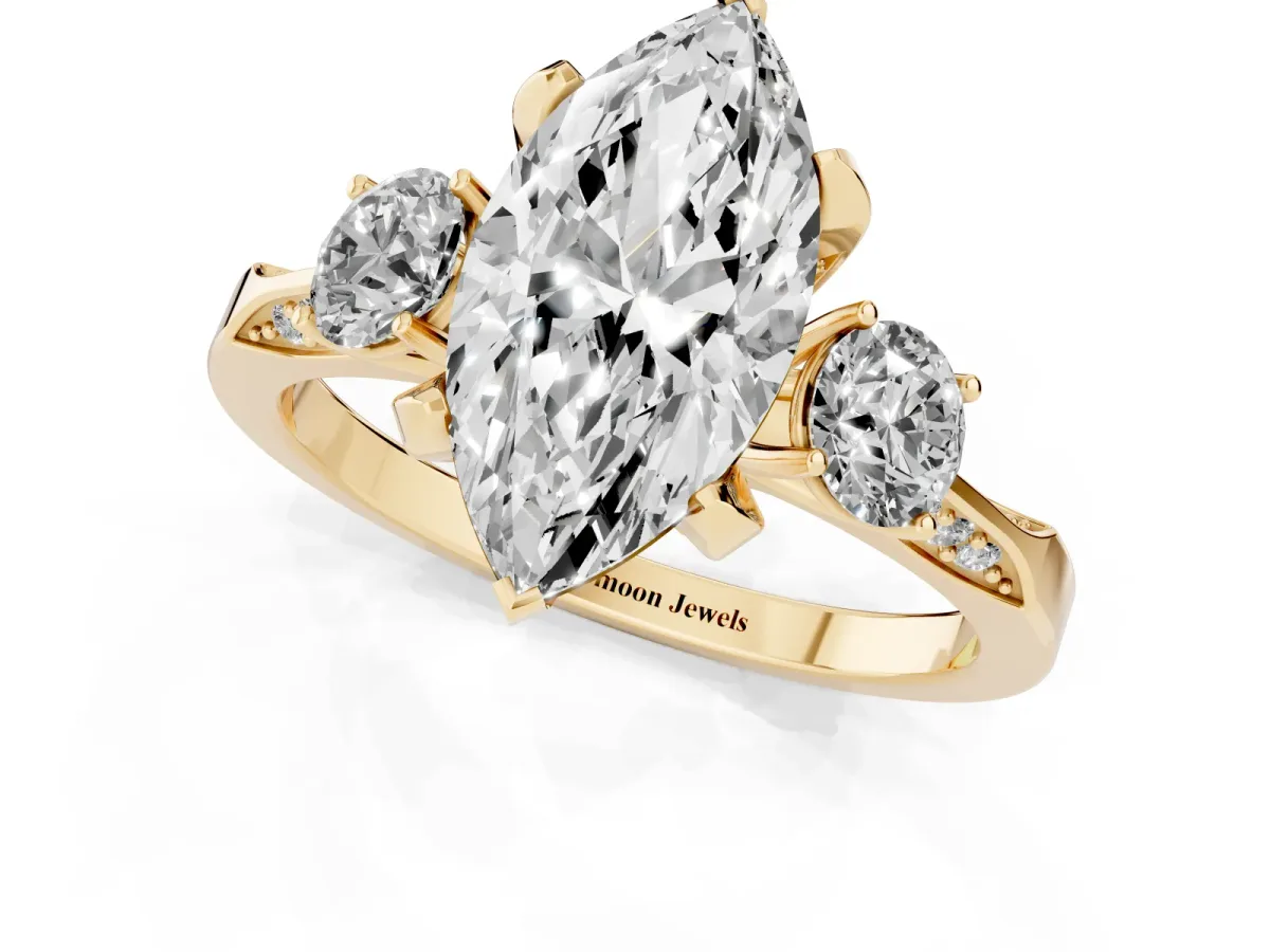 Marquise Cut Brilliant Three-Stone Diamond Ring with Pavé Band and Four-Prong Setting Yellow gold