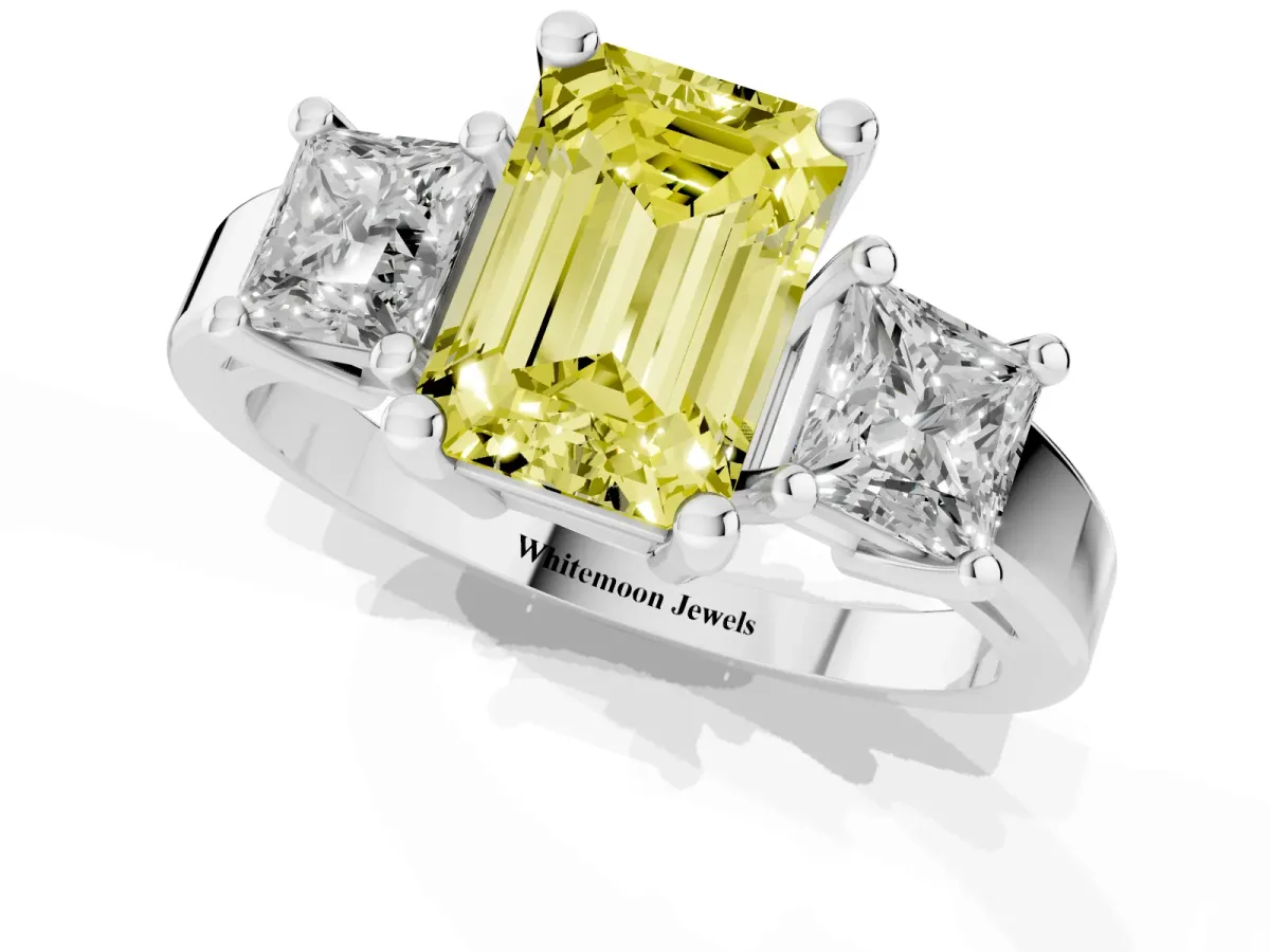 Fancy Yellow Three-Stone Emerald Cut Cut Solitaire Ring with Prong Setting Platinum