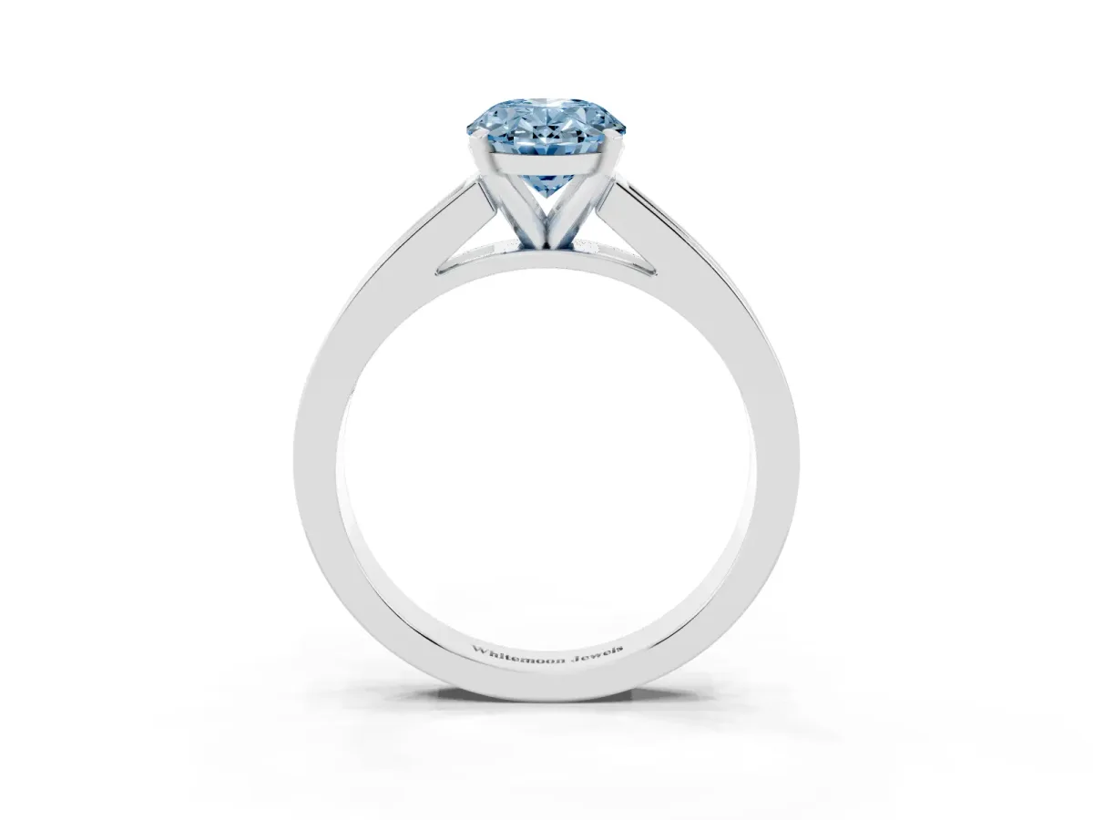 Fancy Blue Oval Cut Solitaire Diamond Ring with Channel-Set Band and Four-Prong Setting Silver